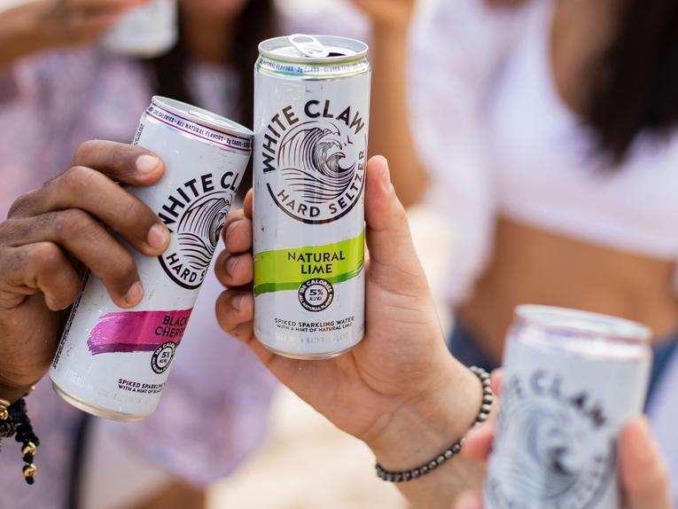 image of women drinking hard seltzer out of a can